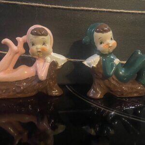 Vintage Pixies on a log